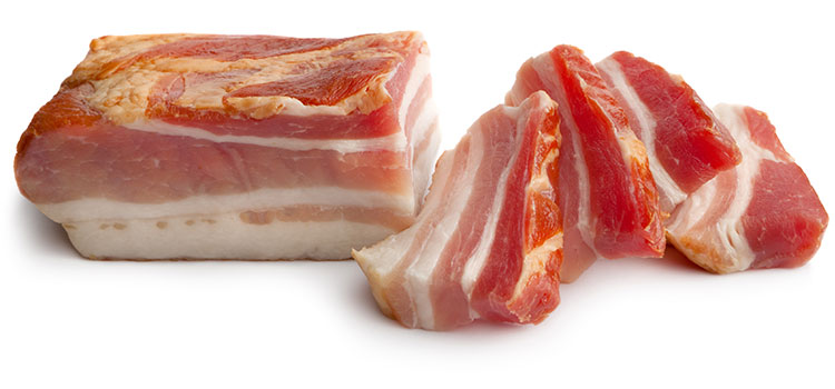 A narrow chunk of smoked pork belly that had four parts sliced off